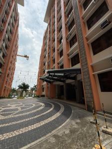 an empty street in front of a building at Paseo Verde at Real in Manila