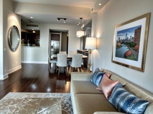 a living room with a couch and a dining room at Santa Monica Executive Suites in Los Angeles