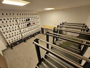 an empty gym with a row of benches in a room at Apartament Czarna Góra TIGNES 4 Sienna in Sienna