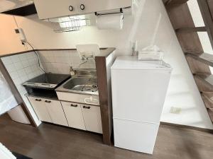 Η κουζίνα ή μικρή κουζίνα στο 西山ハウス101