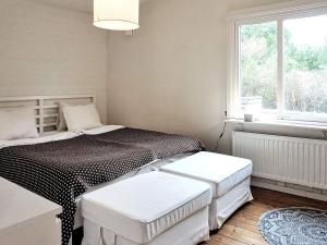 a bedroom with a bed and a window at 5 person holiday home in TRELLEBORG in Trelleborg