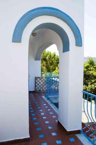 an archway on the balcony of a house at Aparthotel Villa Marinù in Ischia