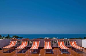 a row of chairs sitting on top of a roof at Aparthotel Villa Marinù in Ischia