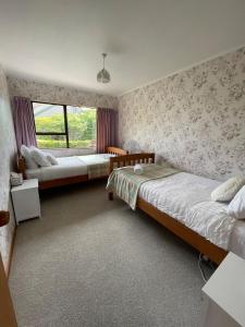 Katil atau katil-katil dalam bilik di Lynmore Views 3 bedroom family home