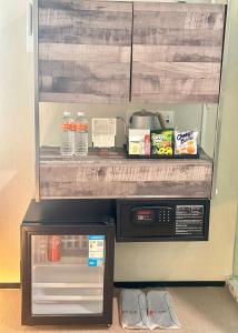 a kitchen with a microwave and a counter top at A Hotel Chinatown- Stay From 8PM To 9AM in Singapore