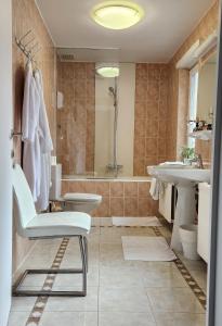 a bathroom with a tub and a sink and a shower at Albert 2 - V2 in Mechelen