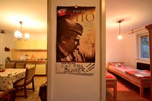 a living room with a movie poster on the wall at Guest House Konjic in Konjic +70 photos