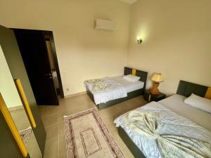 Ένα ή περισσότερα κρεβάτια σε δωμάτιο στο Private pool 4Brs Standalone in Jazz Little venice l Next Hotel