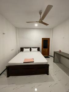 Postel nebo postele na pokoji v ubytování Nimalas Villa