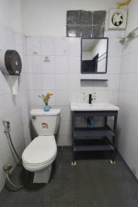 a bathroom with a toilet and a sink at OK hostel in Luang Prabang