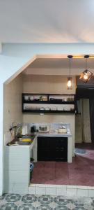 a kitchen with a sink and a counter top at OK hostel in Luang Prabang