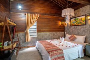 a bedroom with a bed and a window at Memories Hoi An Villa in Hoi An +20 photos