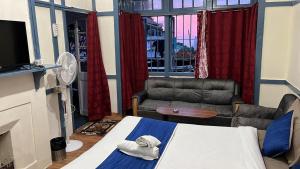 Ένα ή περισσότερα κρεβάτια σε δωμάτιο στο Hideaway Risa Pine Homestay