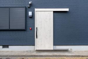 a door on the side of a building at 三十三Tatsu in Kyoto