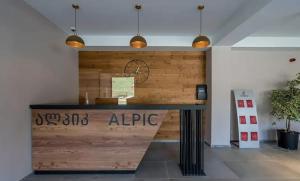 a reception desk in a office with two pendant lights at Redco Alpic 312 New Gudauri - Ziggy Apartment in Gudauri +64 photos