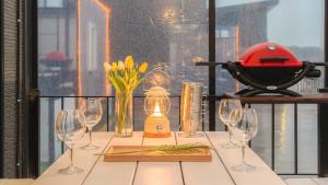 a table topped with wine glasses and a mortar and pestler at Anmyeondo Town 1967 Dog Pool Villa in Taean +1 photo
