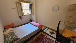 a small room with a bed and a window at Private Room Central, Quite & Beautiful Flat in Cairo