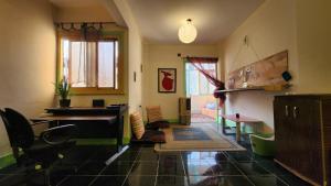 a room with a desk and a piano in it at Private Room Central, Quite & Beautiful Flat in Cairo