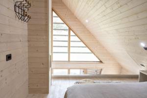 Ένα ή περισσότερα κρεβάτια σε δωμάτιο στο Chalet Aurora