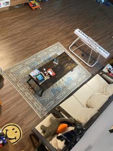 an overhead view of a living room with a couch and a table at Anhbnb in Da Nang