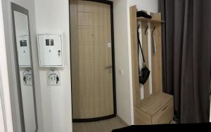 a room with a closet and a door with a mirror at Полтава Поділ по добова оренда in Poltava