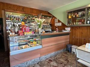 a counter in a restaurant with a display case at La locanda del Grottino in Torgiano +11 photos
