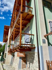 a balcony on the side of a building at La Casa Di Martino in Cesana Torinese