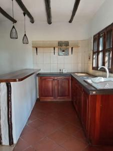 a large kitchen with a sink and a sink at Kk bnb in Mombasa +1 photo