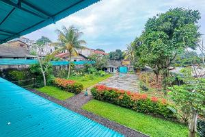 an aerial view of a house with a swimming pool at Garden View near Batu Tulis RedPartner in Bogor