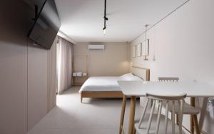 a bedroom with a bed and a table and chairs at נופש ספיר אילת romantic in Eilat