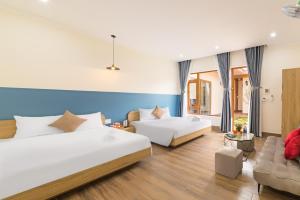 Ένα ή περισσότερα κρεβάτια σε δωμάτιο στο TT House Pleiku +37 φωτογραφίες