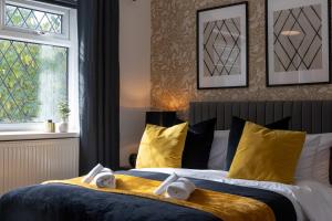 a bedroom with a bed with two teddy bears on it at Spacious Apartment near MCR Airport in Wythenshawe +33 photos