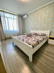 Postel nebo postele na pokoji v ubytování FlatService Апартаменти в сучасному ЖК Parklend