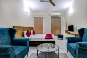 Un lugar para sentarse en Hotel Cocoon Suites Kalyan Nagar