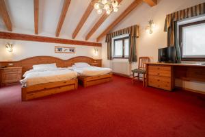Katil atau katil-katil dalam bilik di Dolomiti Hotel Cozzio