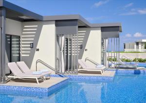 a rendering of a swimming pool with lounge chairs at Address Beach Resort Marassi in El Alamein