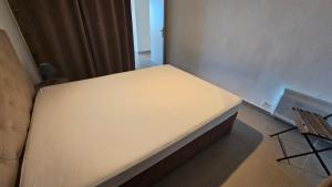 a small room with a bed in a room at DOLCE VITA in Kamiesch +7 photos