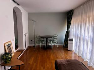 a living room with a table and chairs at 30 Seconds from Pantheon Walk Everywhere in Rome