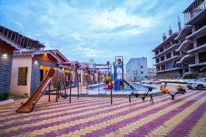 a playground with a slide at The Rath Inns in Mandarmoni