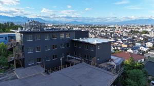 a building with a view of a city at MUST WIN Hotel in Takasaki