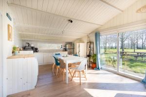 a kitchen and dining room with a table and chairs at Gite El Camino in LʼHerbergement