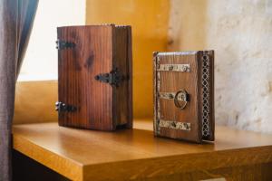 two wooden boxes sitting on a wooden shelf at L'Apto - Gîtes à la ferme - Jardin avec plancha in Chicheboville