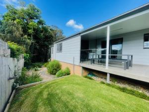 a view of the backyard of a house at Seaside Escape - 5 BR 2 Kitchens in Port Macquarie