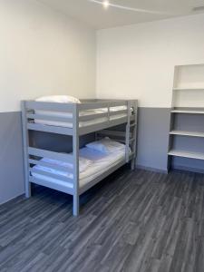 a bunk bed room with bunk beds in it at Appartement de standing en centre ville in Orange