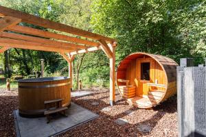 a small wooden sauna with a wooden gazebo at Résidence Lage Vuursche in Lage-Vuursche +22 photos