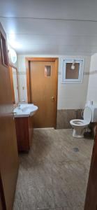 a bathroom with a toilet and a sink at New on site !! cozy apartment with full sea view in Eilat +5 photos