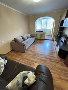 a living room with a couch and a table at Holovna-Depot in Chernivtsi