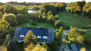 an aerial view of a house with a yard at SIEDLISKO GąSKA in Maszewko