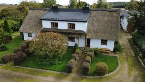 an aerial view of a house with a roof at SIEDLISKO GąSKA in Maszewko