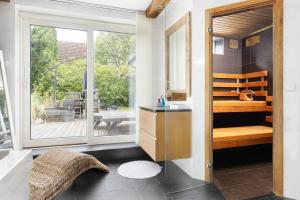 Una cama o camas en una habitación de Harmonious villa with sauna in a quiet area